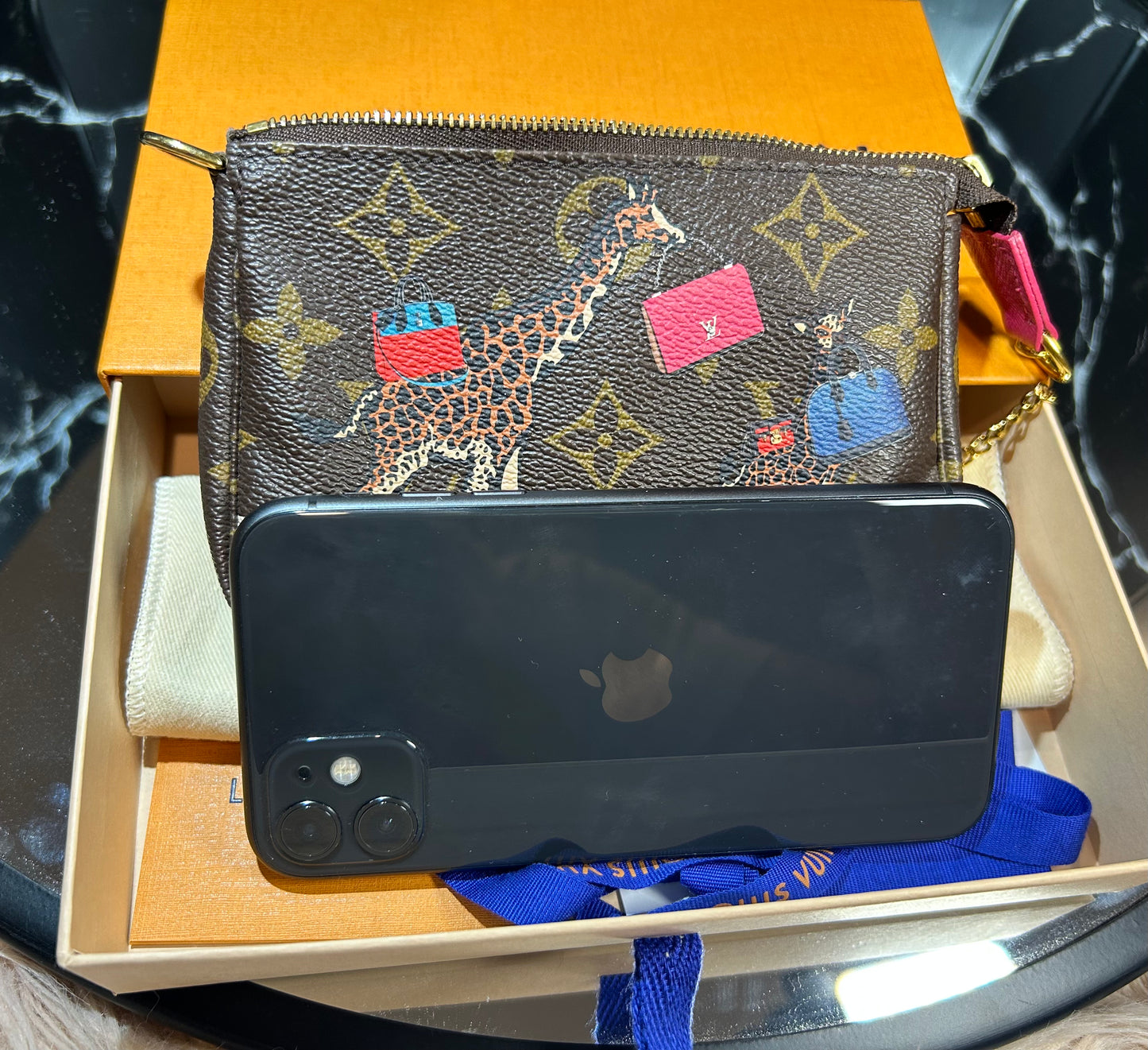 Louis Vuitton Mini Pochette Accessoires – Christmas Edition (Giraffes Print)